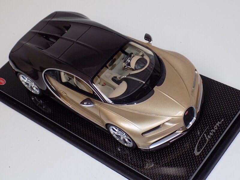 1/18 MR Collection Bugatti Chiron in Gold and Brown Carbon Fiber on Carbon Base $929.95 ModelCarsHub