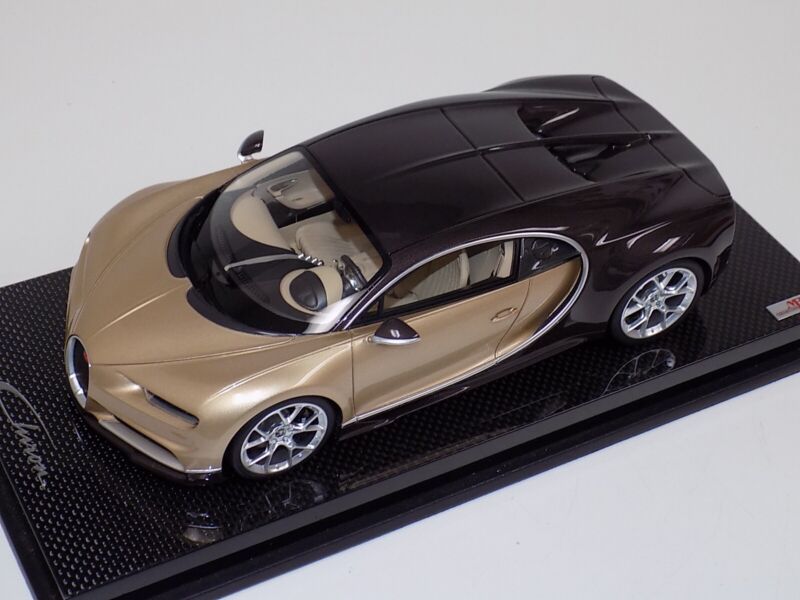1/18 MR Collection Bugatti Chiron in Gold and Brown Carbon Fiber on Carbon Base $929.95 ModelCarsHub