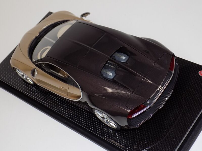 1/18 MR Collection Bugatti Chiron in Gold and Brown Carbon Fiber on Carbon Base $929.95 ModelCarsHub