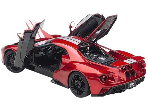 1/18 Autoart 2017 Ford GT Liquid Red with Silver Stripes Real rubber tires. Steerable wheels. Has carpeted interior. Functioning rear spoiler. This item is made of composite. Opening hood, doors and engine compartment. Detailed exterior, interior, engine